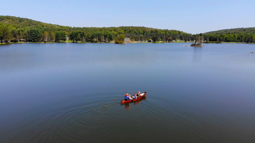 Canoe Family Rainbow Lake Expanse