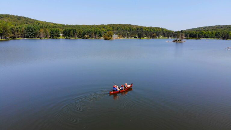 Canoe Family Rainbow Lake Expanse