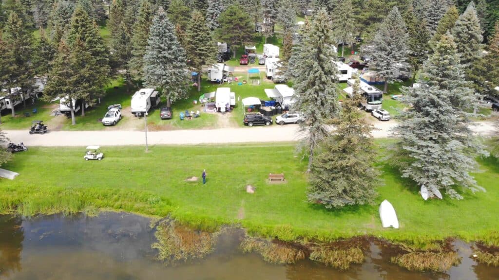 An aerial view of a resort near a lake.