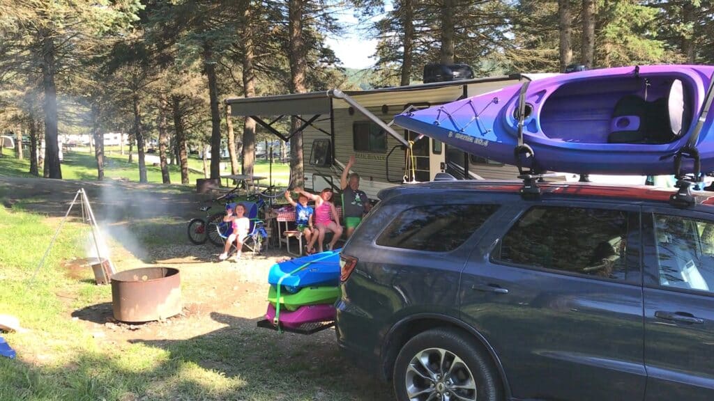 RV Site Family 4 Kayaks On Car