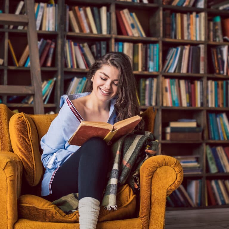 Reading,smiling,young,beautiful,woman.,happy,relaxed,weekend,in,home