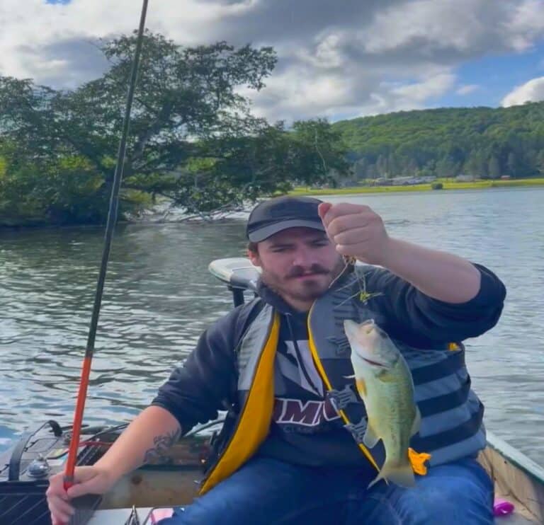 Amr Fishing Phone Vid Holding Fish